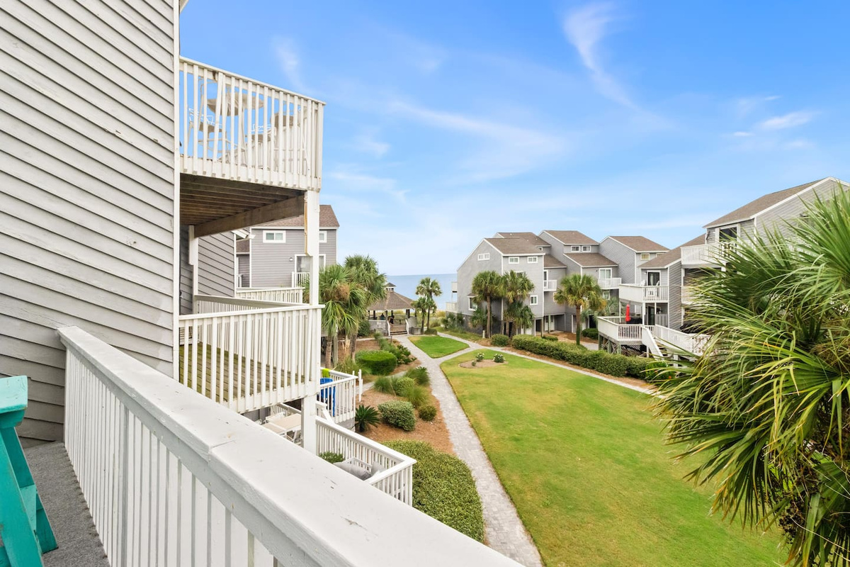 Walk out the gate, cross the boardwalk, and your toes are in the sand in under a minute.