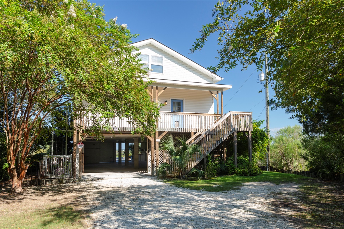 Elevated coastal design with convenient covered parking below the home.