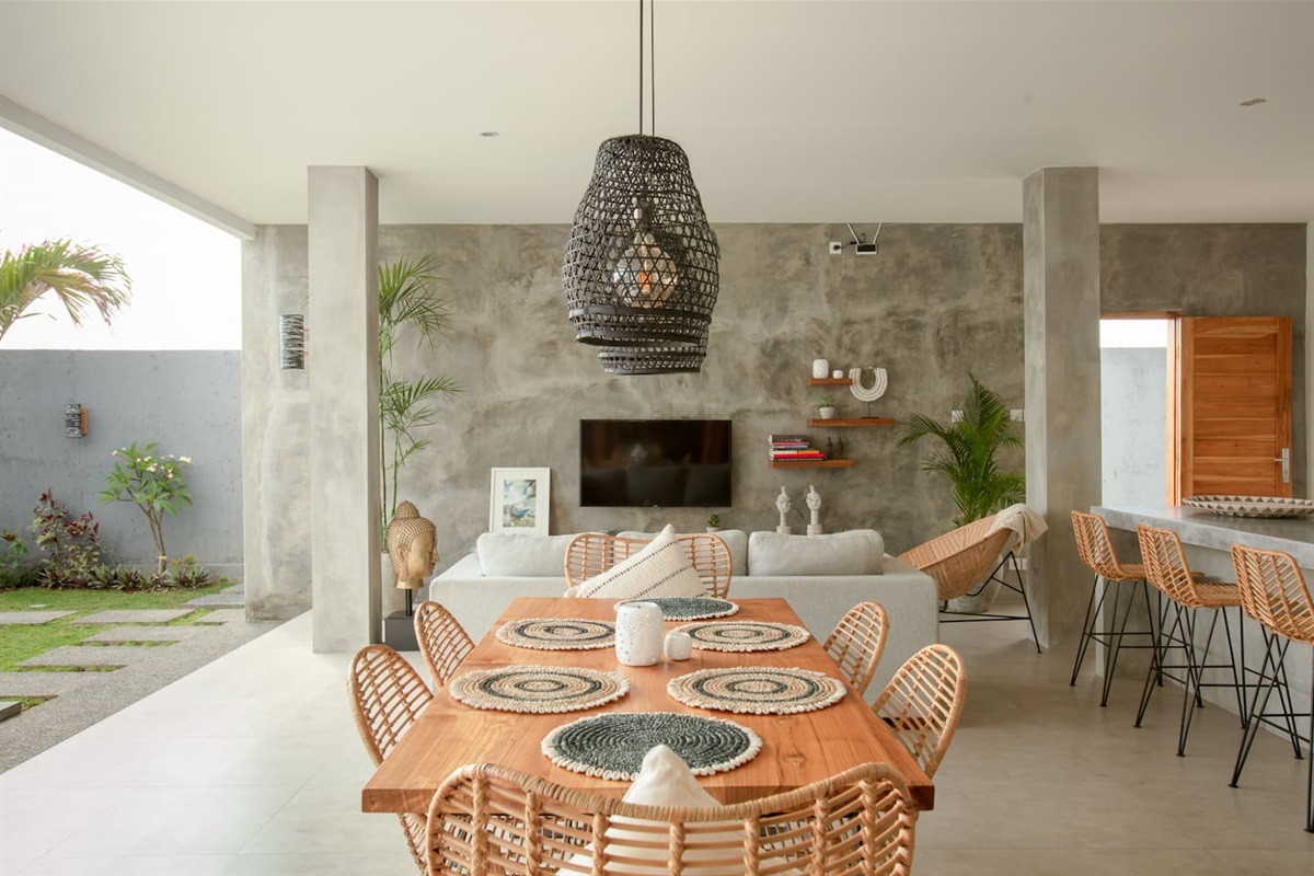 A welcoming dining table for six, ideal for enjoying a meal outdoors under the gentle Balinese breeze.
