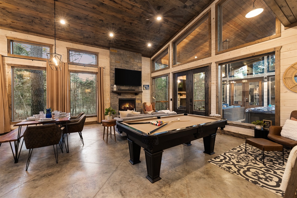 A cheerful game bunkhouse designed for connection and play, complete with a pool table and room to relax.