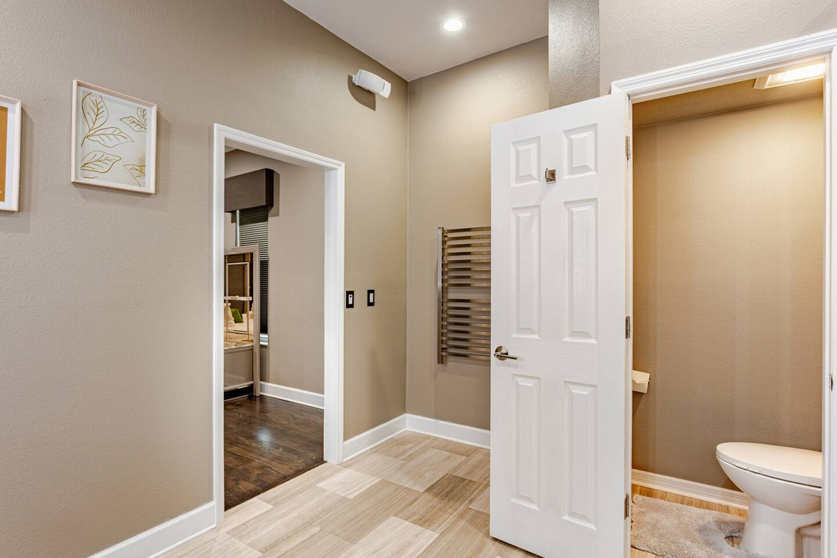 Indulge in a luxurious master bathroom featuring a spacious walk-in shower, sophisticated finishes, ample room to unwind, and elegant details that create a serene, spa-like retreat.
