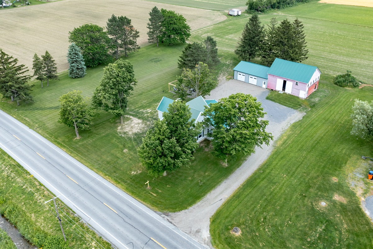 Peaceful country living with a charming home, spacious barn, and wide open green space—perfect for outdoor lovers and hobbyists alike.