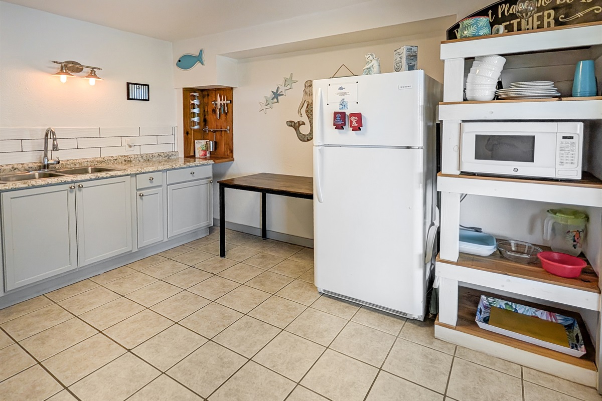 The kitchen leads out to the deck and hot tub
