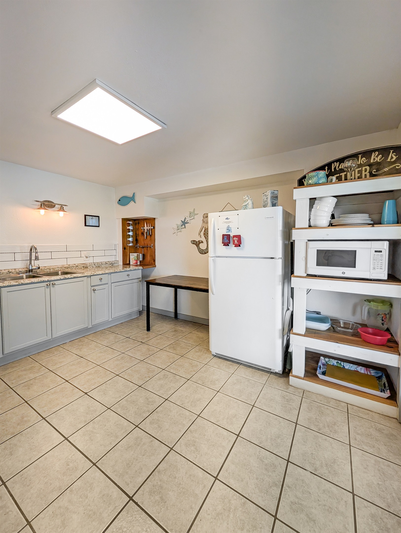 The kitchen leads out to the deck and hot tub