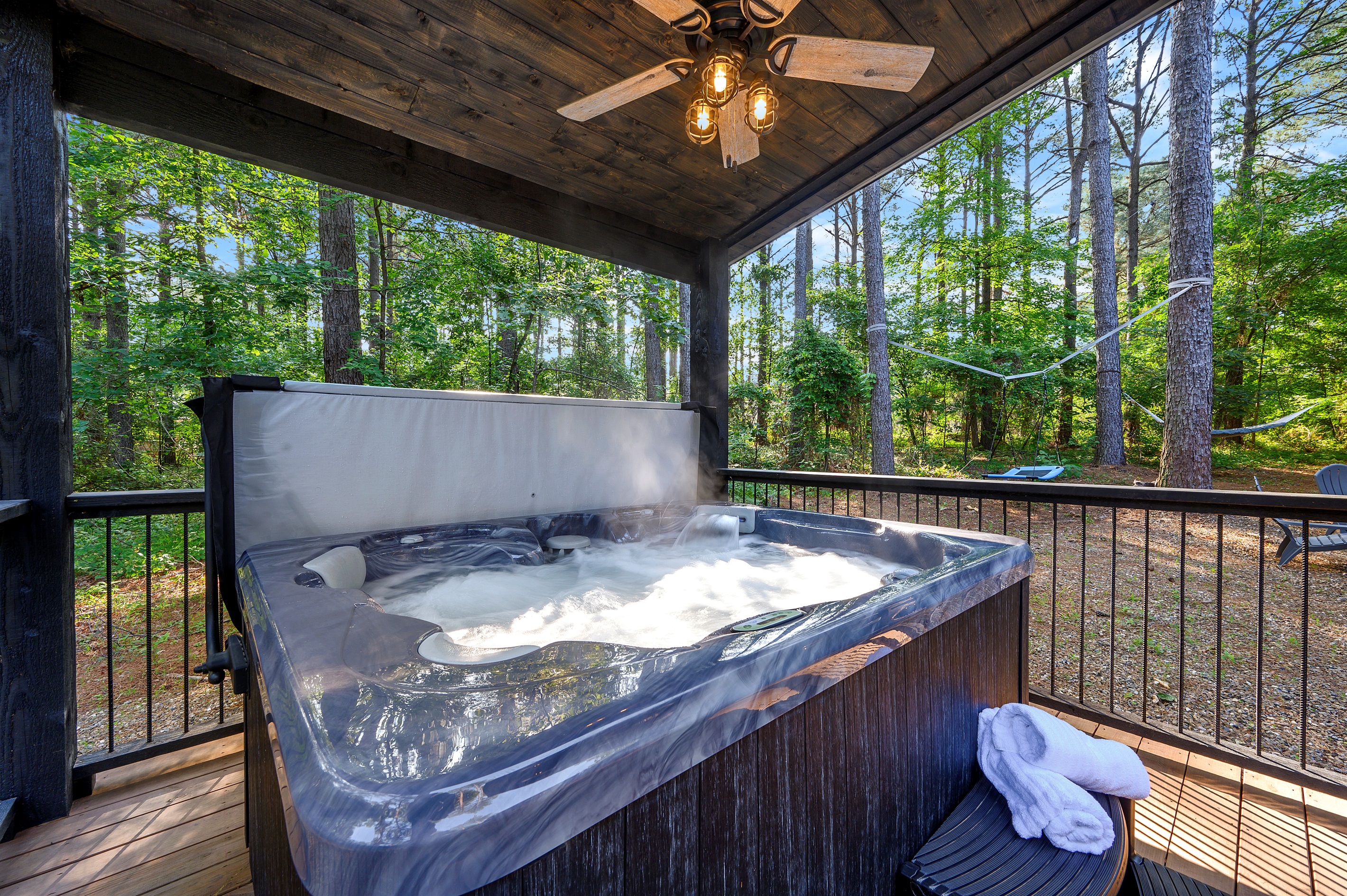 Private hot tub with serene wooded views