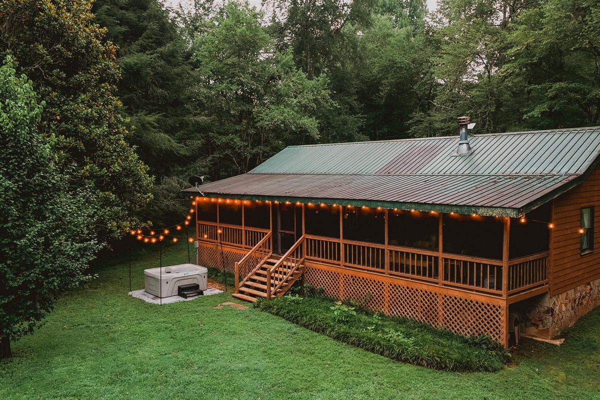 Enjoy the covered porch and secluded hot tub!