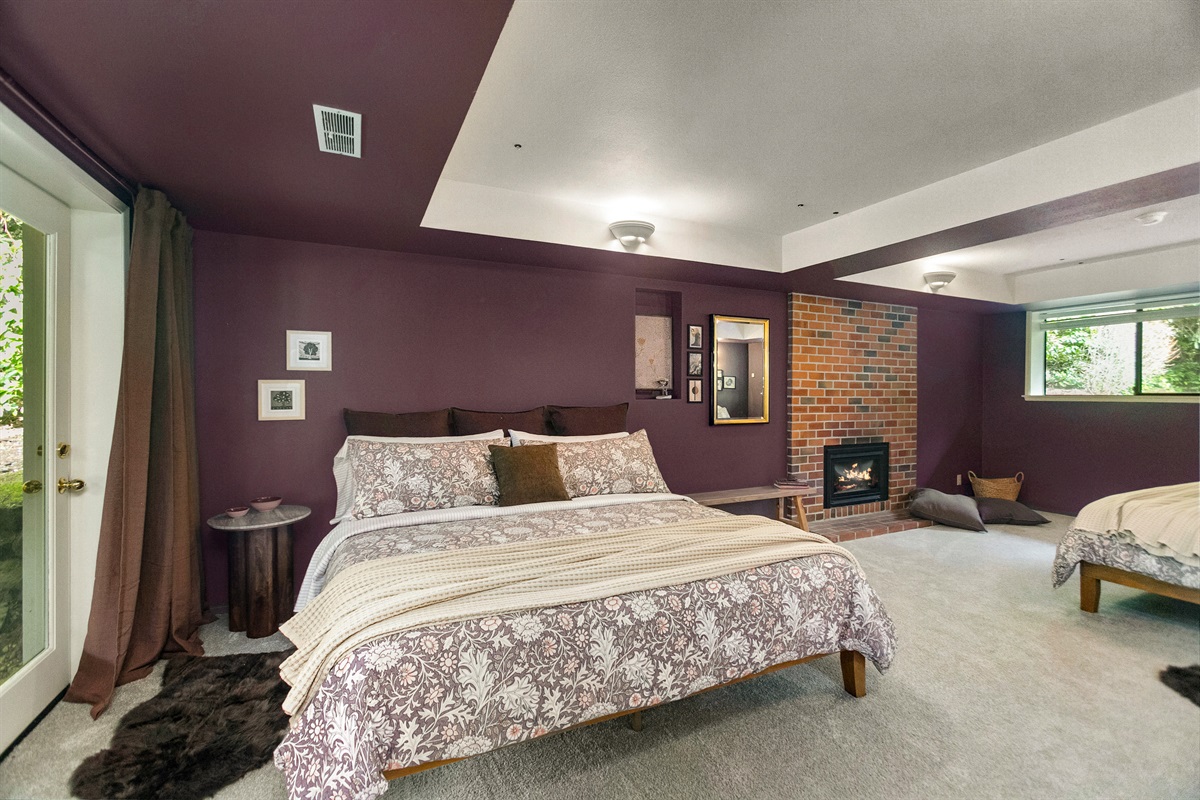 The huge lower bedroom suite features its own fireplace.