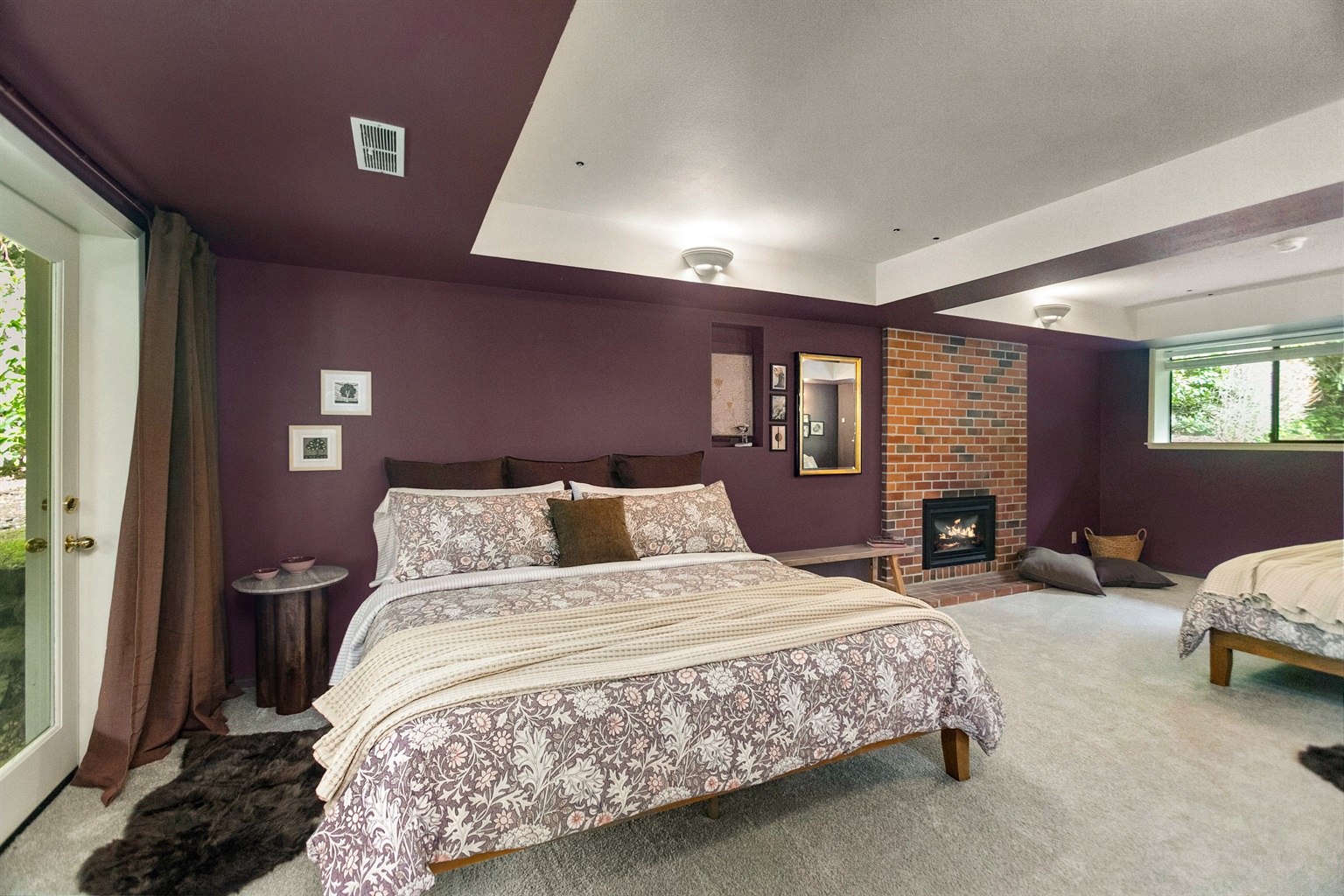 The huge lower bedroom suite features its own fireplace.
