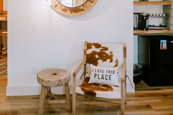A leather reading chair and a getting-ready vanity make Bedroom #1 a suite of its own.