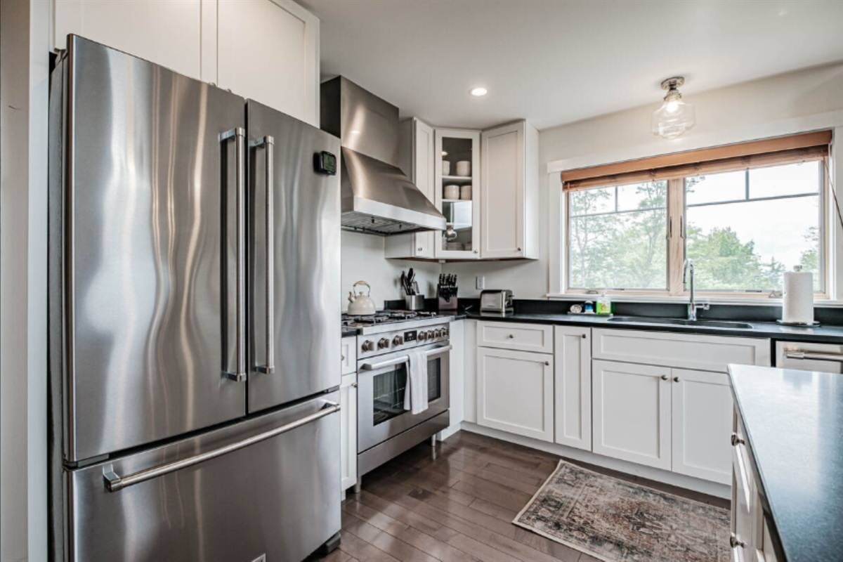 Fully equipped kitchen with a stylish island, perfect for cooking and gathering.