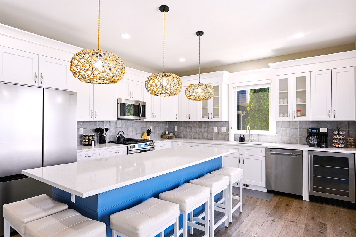 Thoughtfully designed with abundant storage, quality appliances, and a large island, this kitchen has everything you need to feel right at home.
