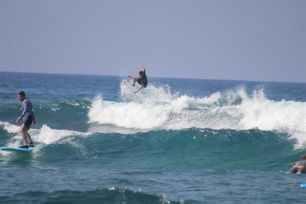 Surf or learn to surf at Kahalu’u Beach Park, just 3 mins drive away