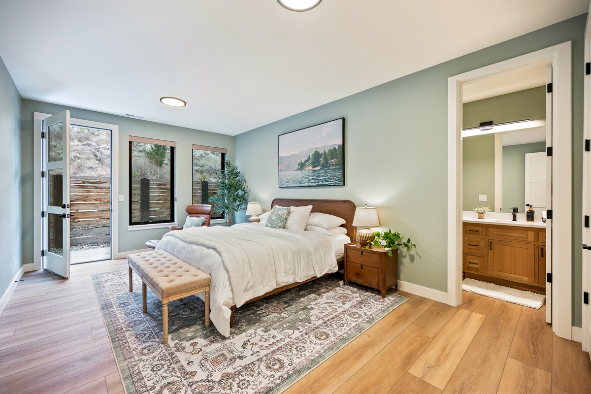 Bedroom #2 of 7 - Main floor, king bed, Smart TV, ensuite with walk in shower, and separate exterior exit/entrance