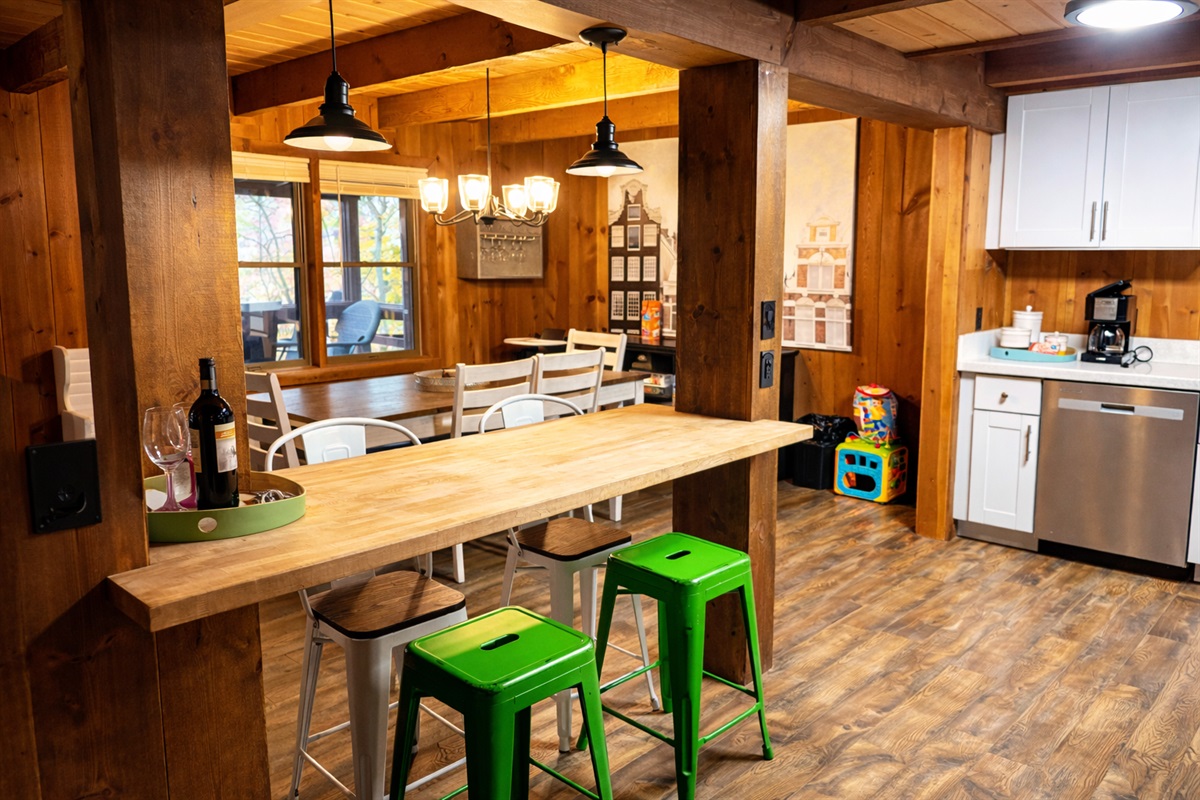 Gather for meals, morning coffee, or evening wine at the breakfast bar while the dining table nearby makes the perfect spot for family dinners.