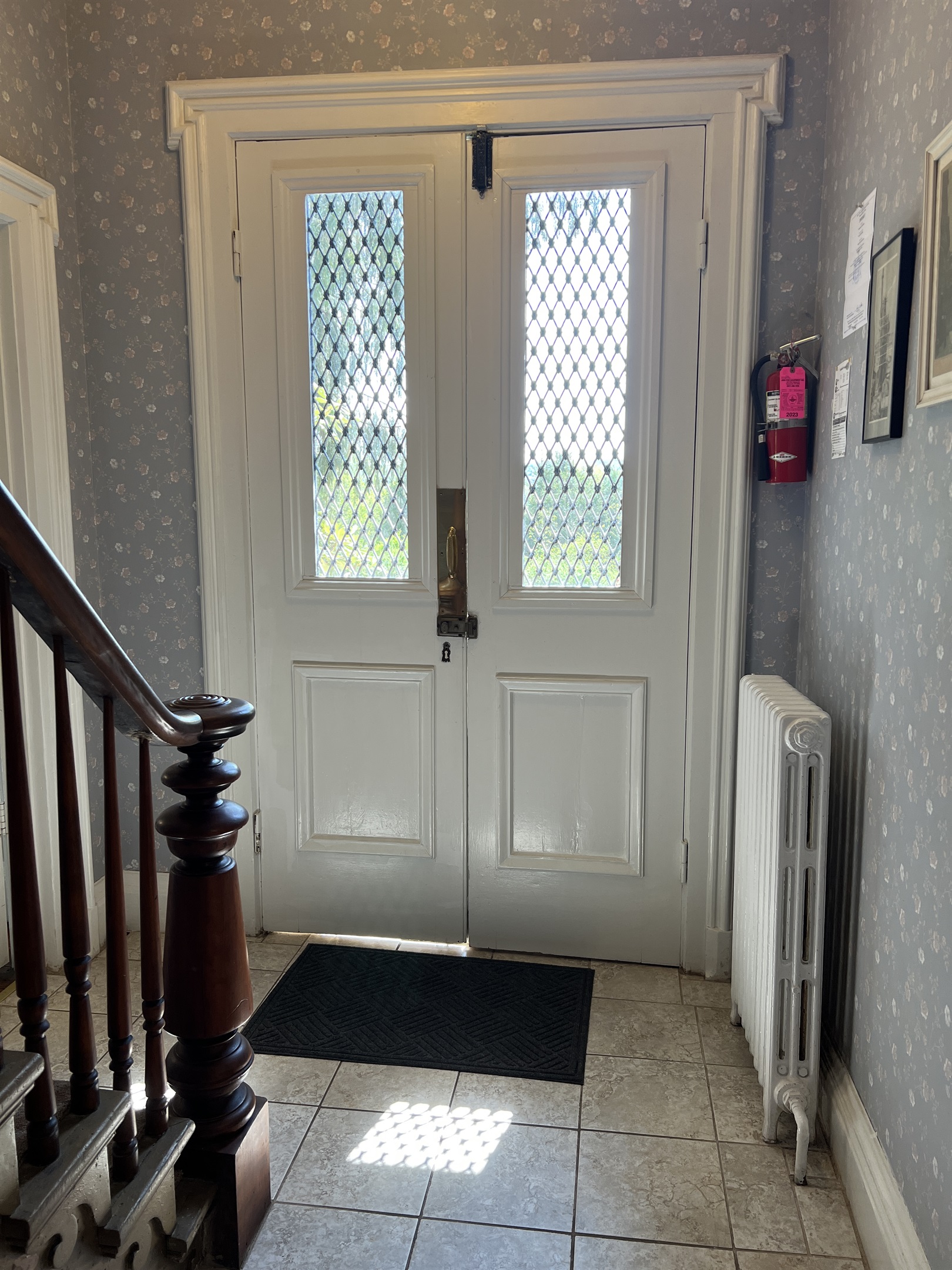 Original front doors reclaimed to retain the vintage charm.