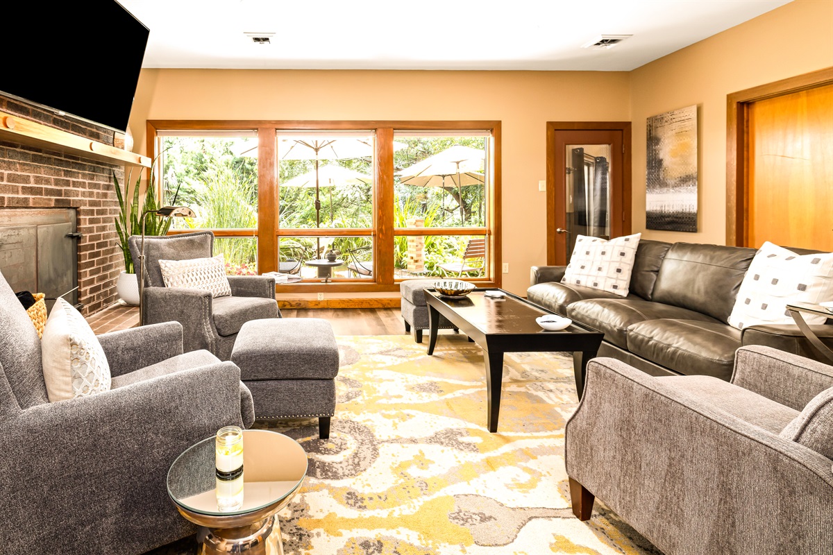 Lower level family/great room is perfect for catching up, watching a game or the Koi!