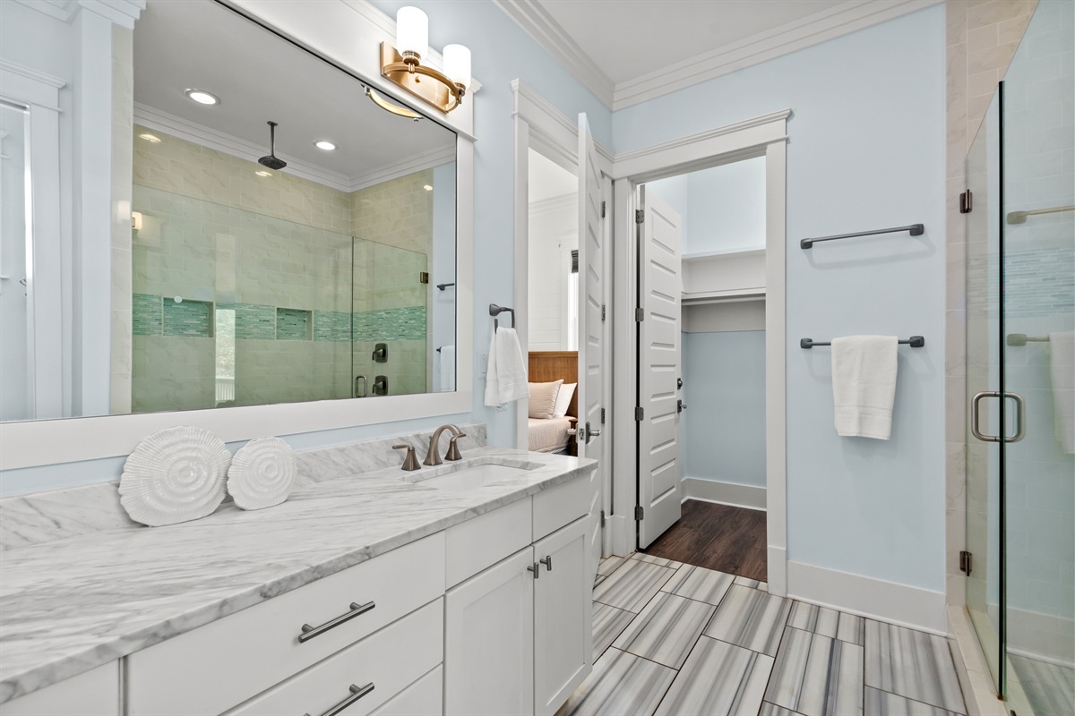 This spacious master bathroom gives you plenty of room to spread out and make yourself at home.