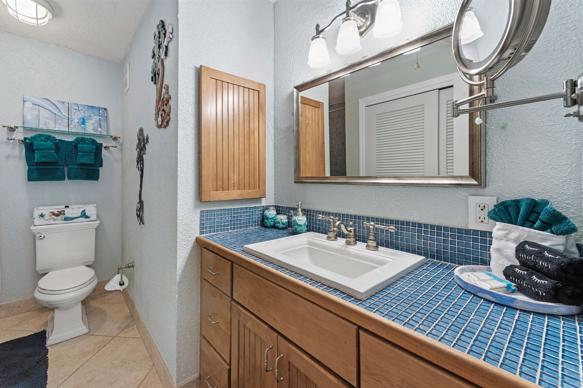 The primary bathroom offers a combination tub/shower and modern vanity for your convenience.