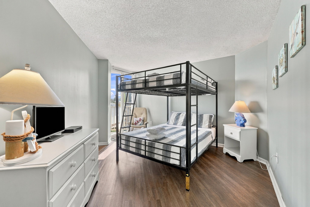 Cozy bunk setup, perfect for kids or extra guests to recharge after a day at the beach.