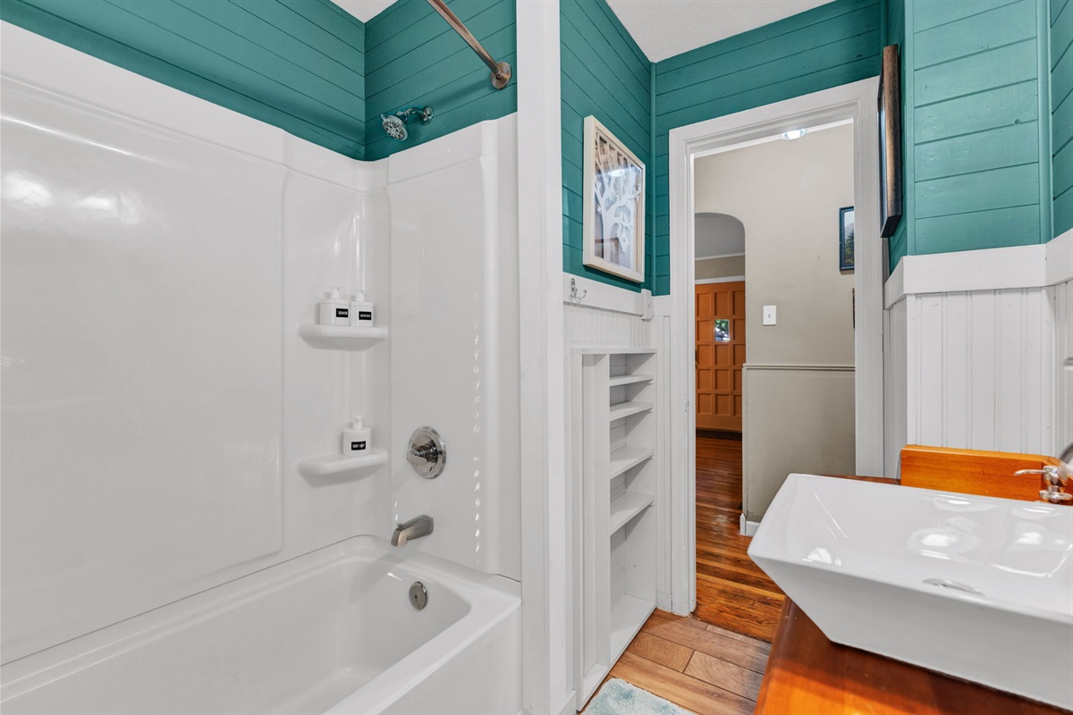 Another view of our full bathroom, featuring a shower and tub.