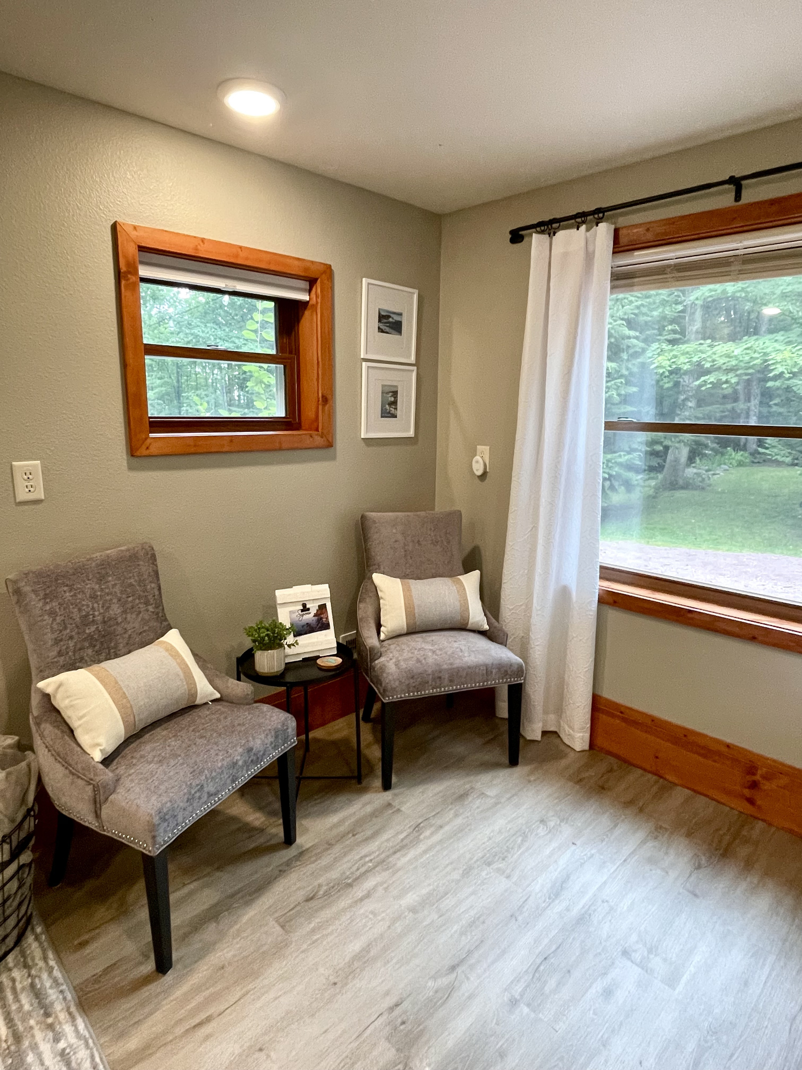 Bedroom lower level seating area next to the large window    *note this is main lower entry level must take stairs to access upper loft kitchen living bathroom* 