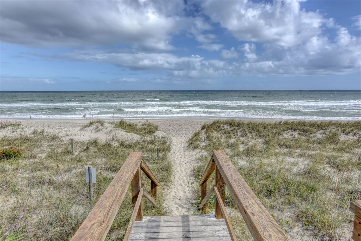 Steps away from the beautiful beach. Come make some memories in the sand and waves! 