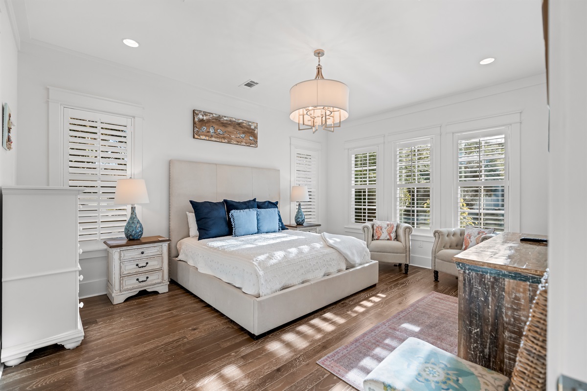 The spacious main floor master retreat boasts a king size bed & has an ensuite bathroom with a walk-in shower, walk-in closet, water closet and dual sinks. Conveniently located down the hall away from the family gathering spaces. 
