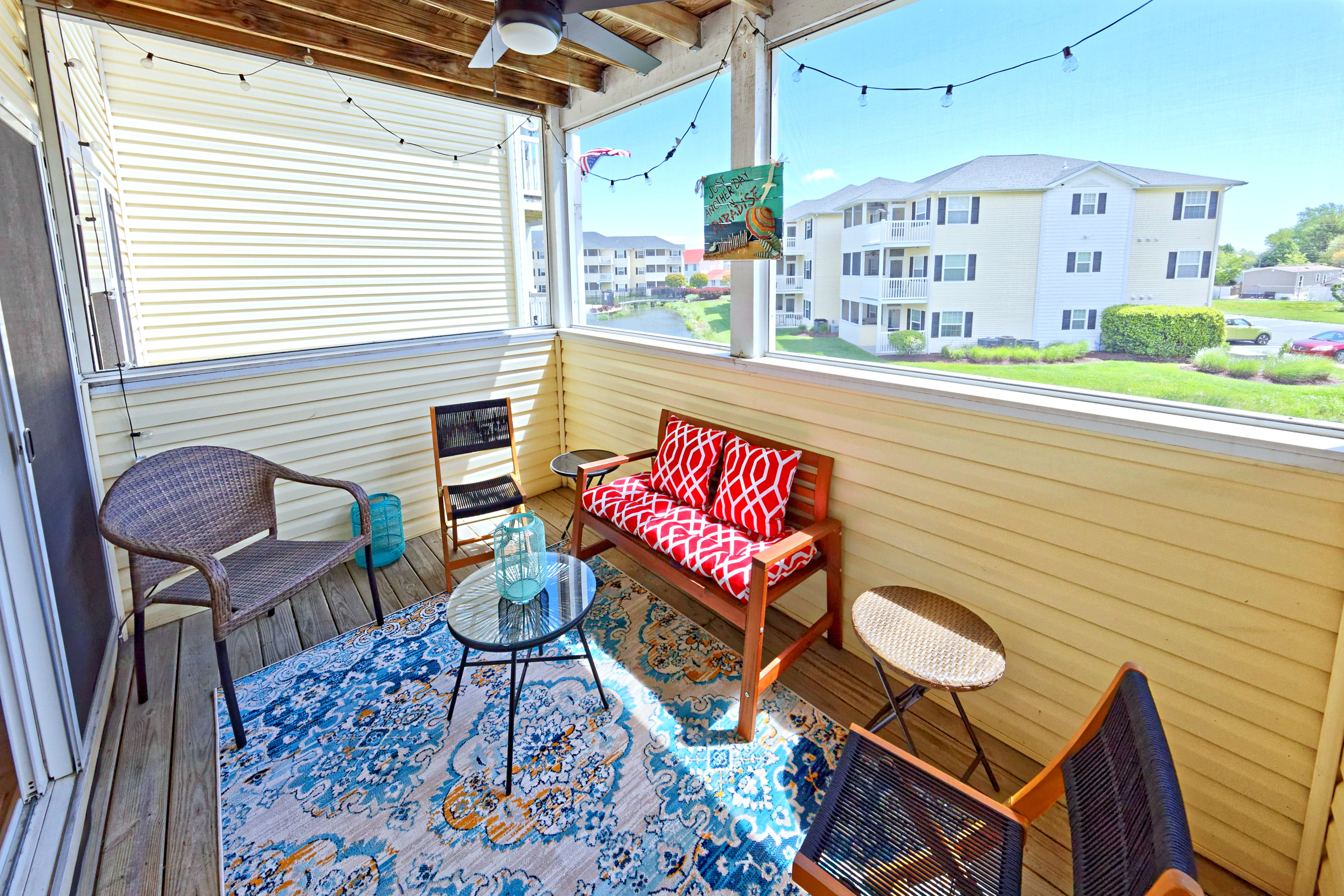Screened Porch: Sip your morning coffee with vibrant decor and serene views!