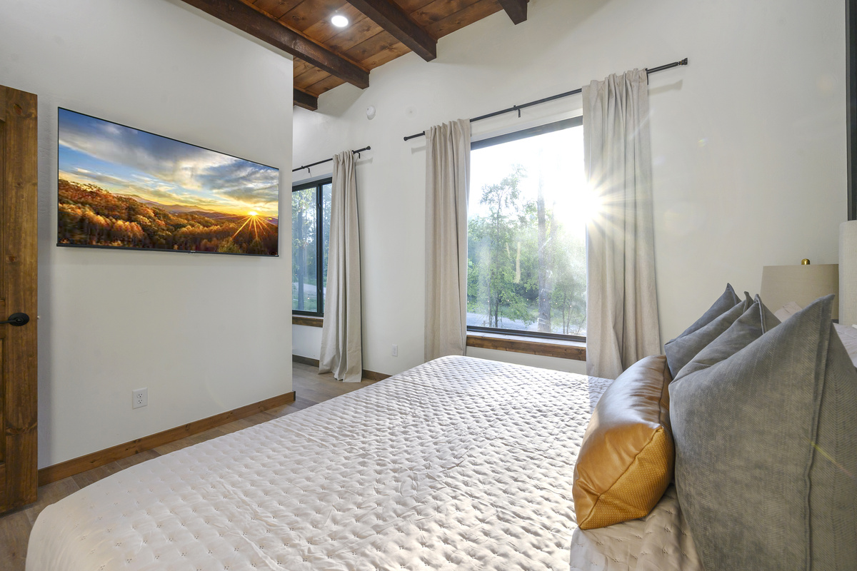 Wake up with sunlight pouring through the pines. Slow mornings feel a little better here.

