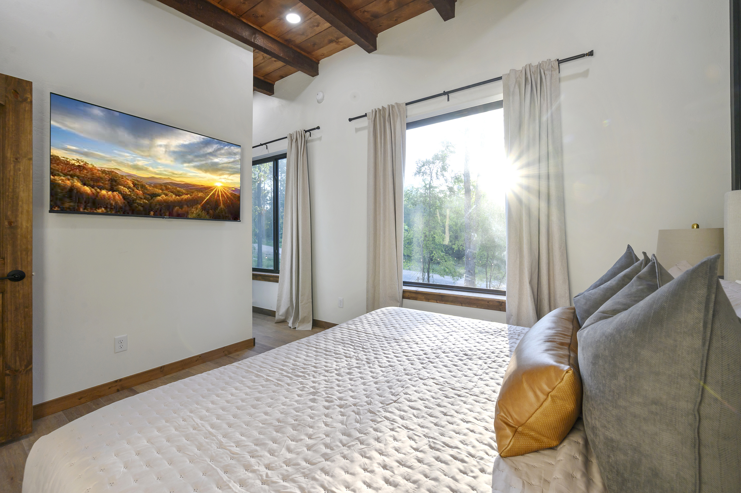 Wake up with sunlight pouring through the pines. Slow mornings feel a little better here.
