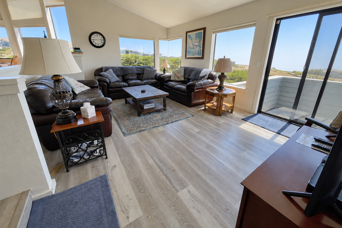 Living Room with lots of natural lighting and vaulted ceilings