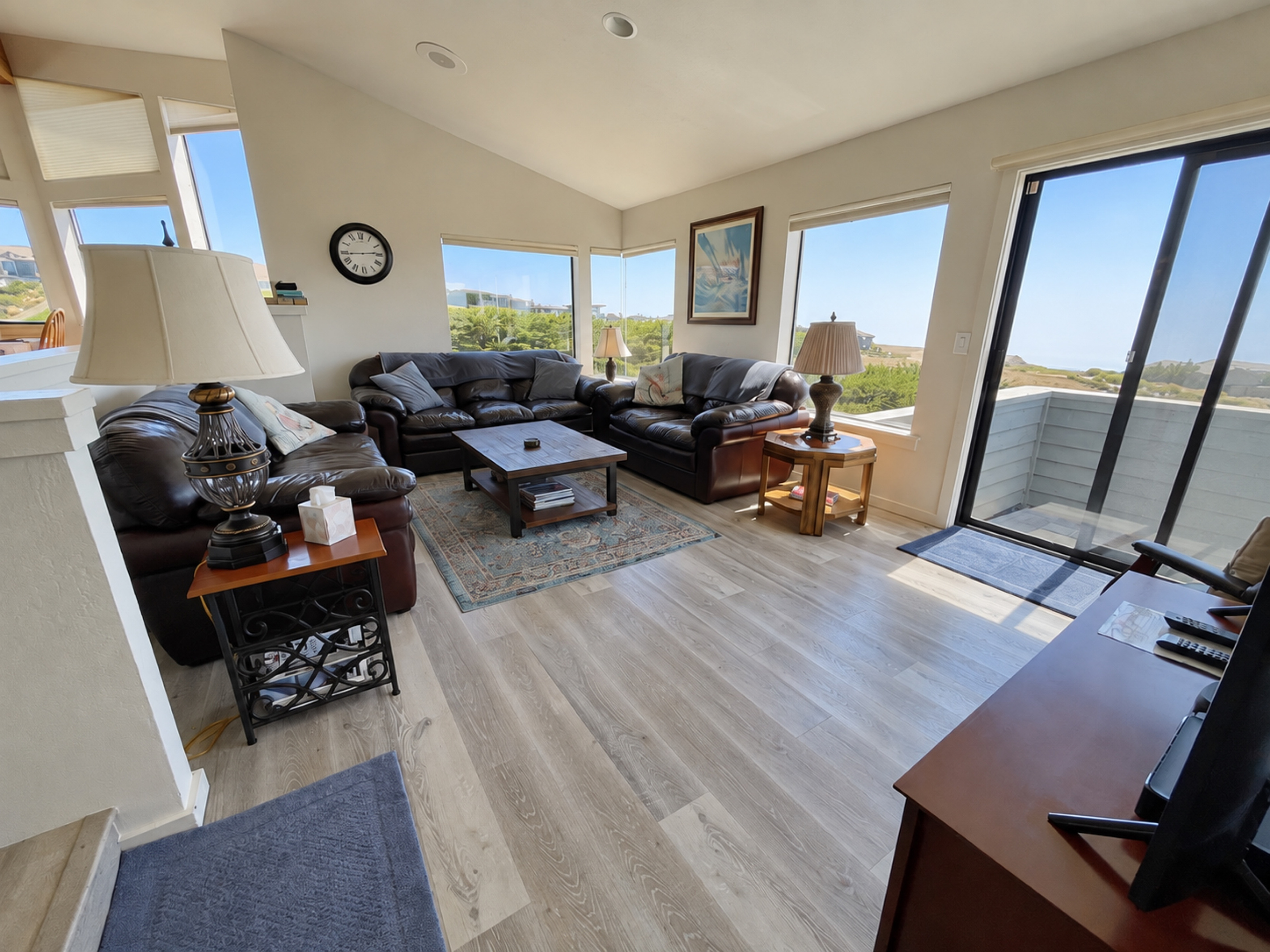 Living Room with lots of natural lighting and vaulted ceilings