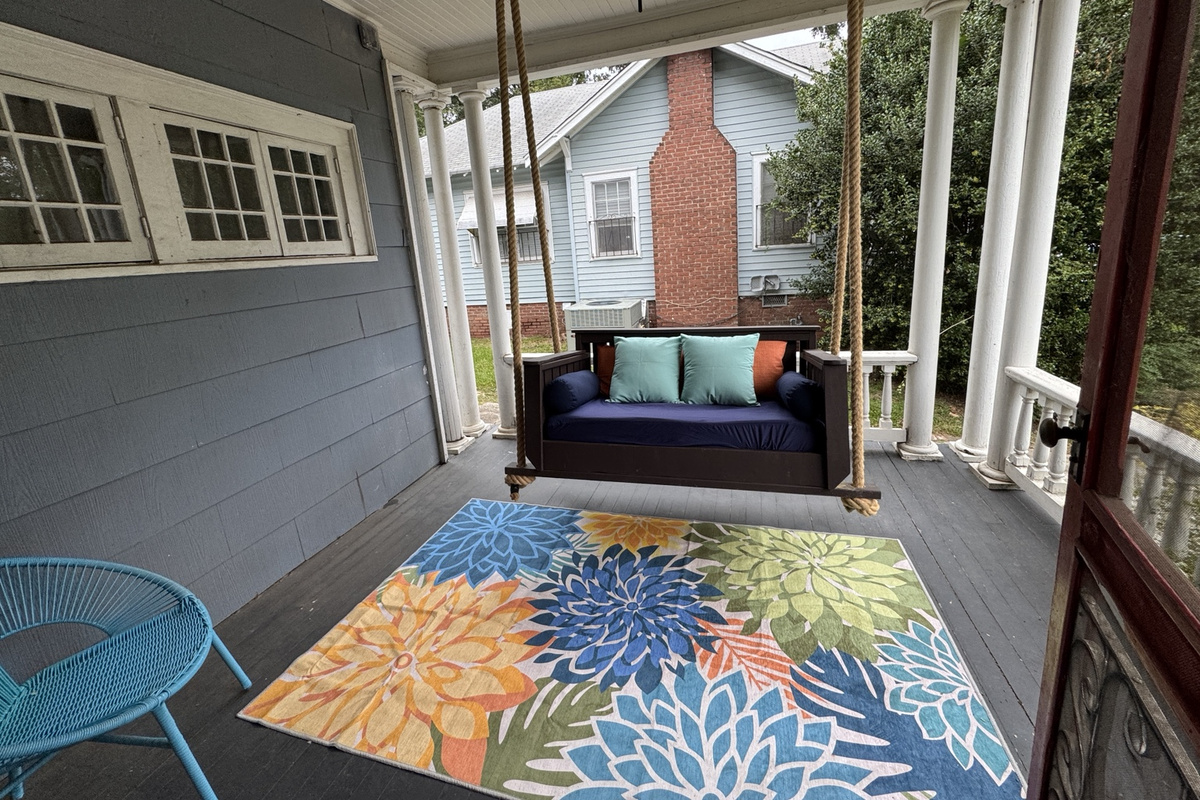 Swing away the day on the porch bed