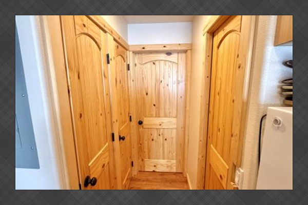 Hallway leading to bathroom, bedroom area.