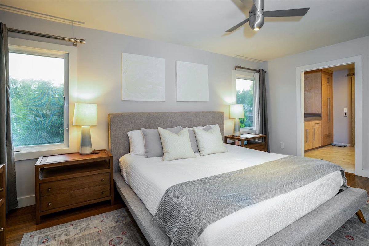 Primary bedroom with king bed and smart tv.