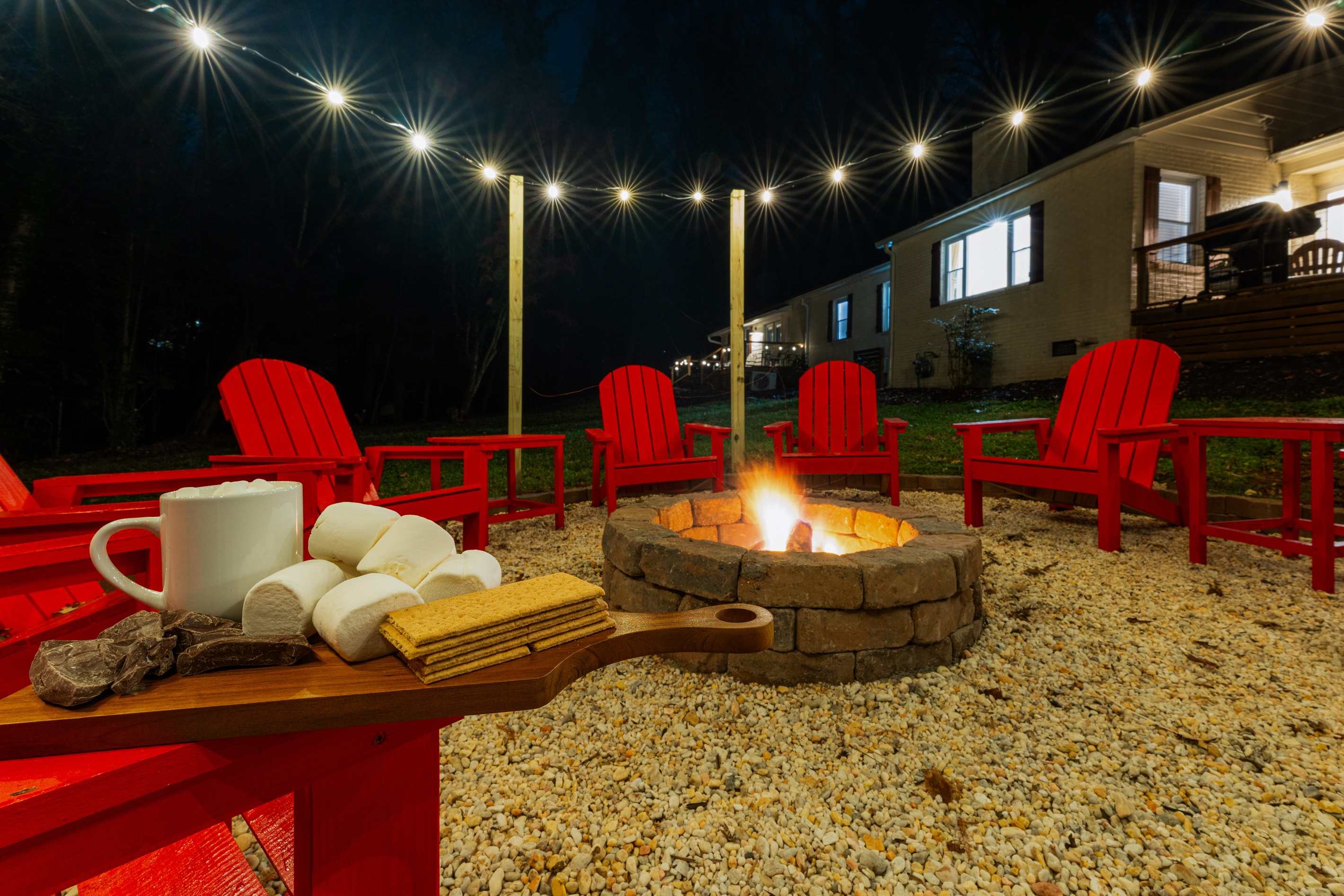 Enjoy unforgettable nights around the fire with cozy seating, string lights, and everything you need for the perfect s’mores experience.