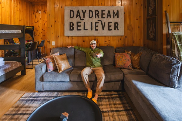 Kick back on the cozy sectional, press play, and settle in for a movie night in the mountains.