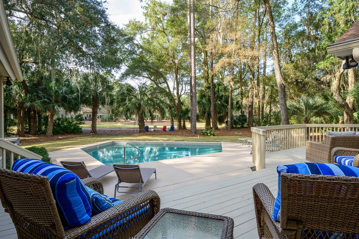 View from large deck to pool and #11 green on Heron Pointe