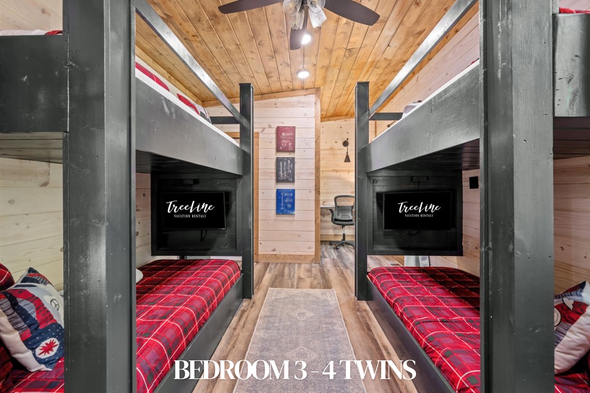 Bedroom 3: Four twin beds in custom bunk style—perfect for kids or groups.