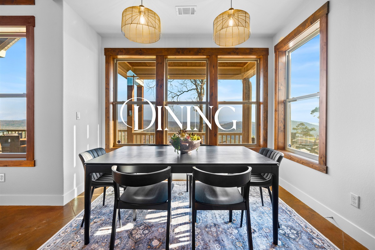 The dining area is wrapped in windows, creating the perfect spot to enjoy meals while soaking in the peaceful mountain landscape.