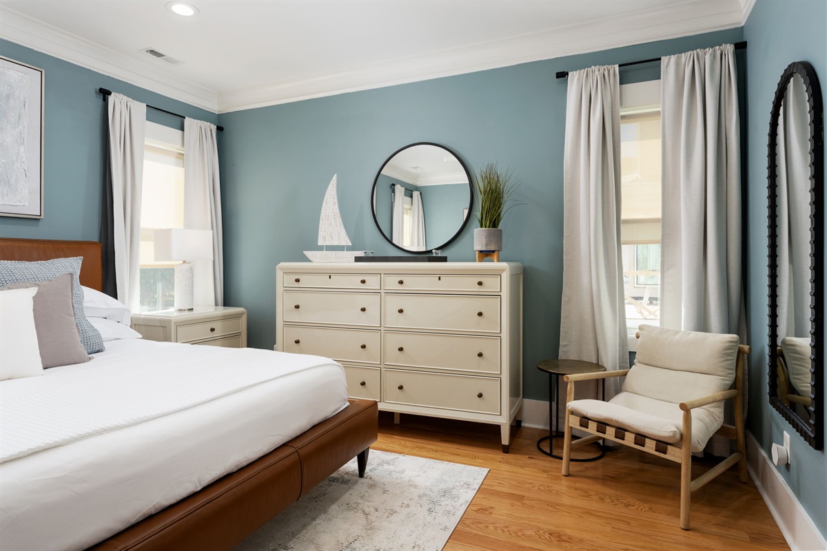 Thoughtfully designed primary suite with ample storage and a cozy seating nook.