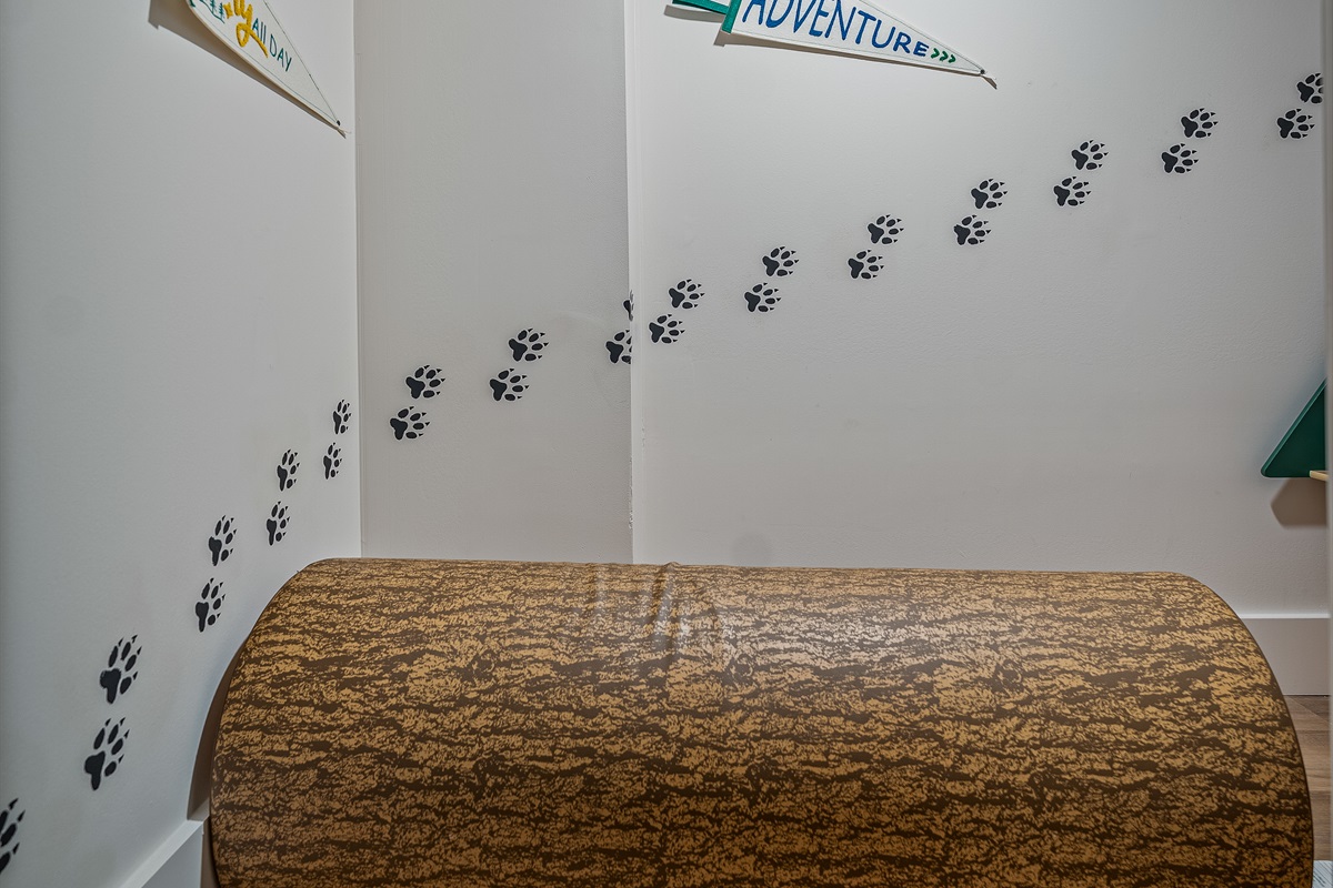 Cozy woodland kids’ nook with books and toys