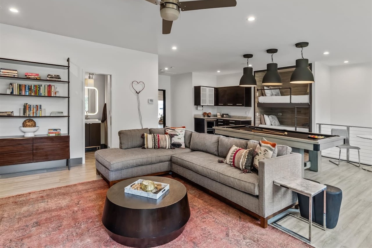 Second floor bunkroom with trundle and brand new pool table, coffee bar, refrigerator and shuffleboard