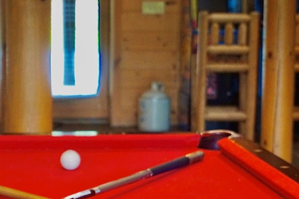 Unleash your competitive spirit with a classic pool table and vibrant decor!