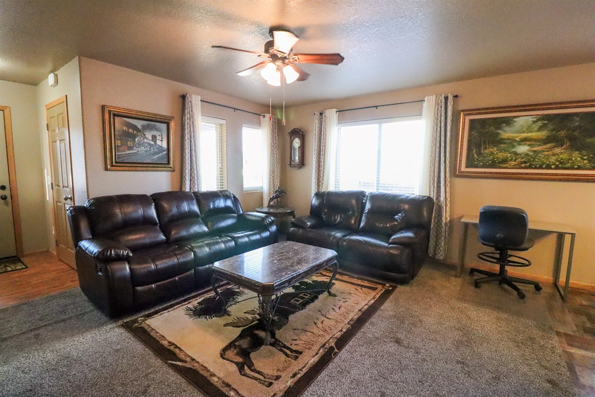 Living room with desk workspace
