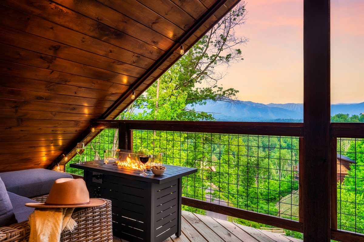 Unwind with friends by the third deck fire pit table and enjoy the stunning views. Enjoy a comfortable conversation set and a double egg swing by the fire pit table