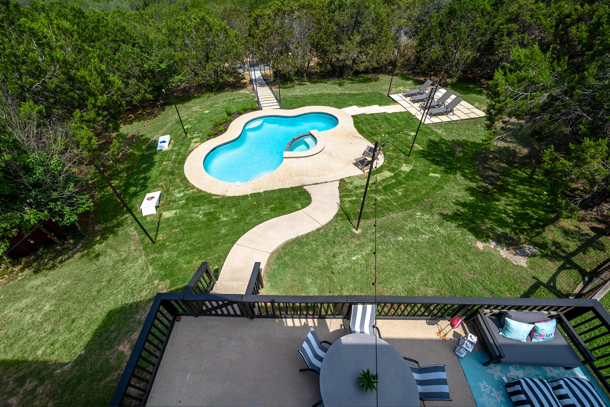 Aerial view captures the pool's unique curved design.