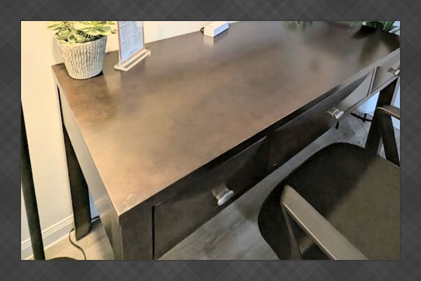 Large desk space with easily accessible charging for your laptop or devices. 