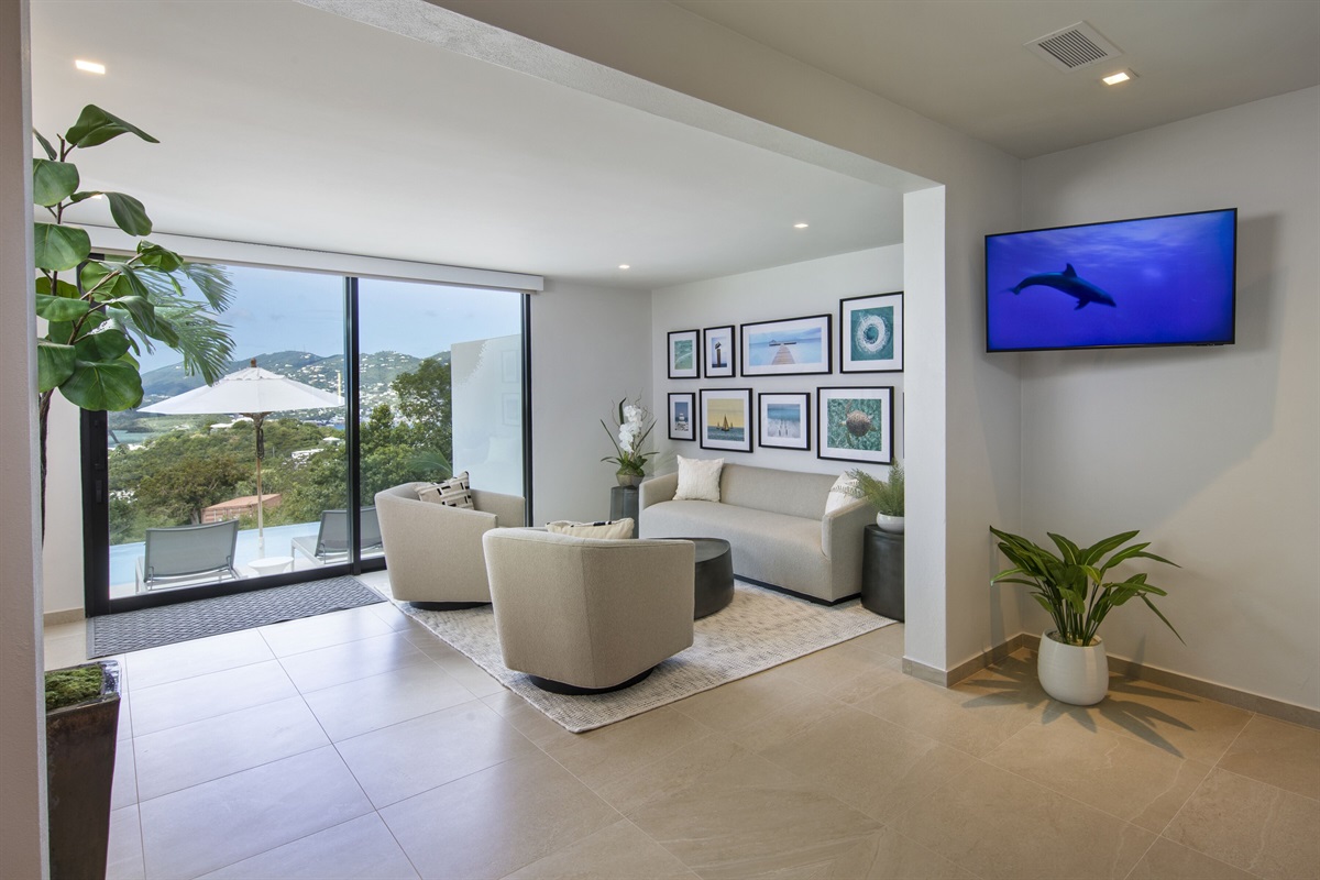 Primary Bedroom 1 - Main level. This suite has a living room and access to pool deck.