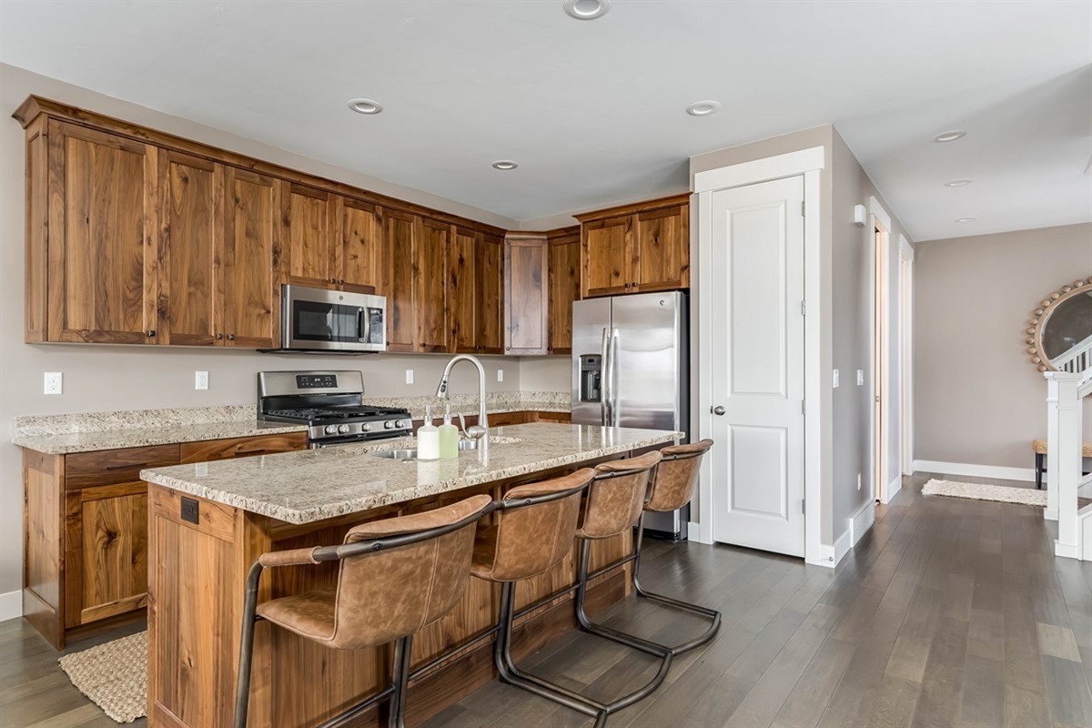 Beautiful chef’s kitchen with island seating—perfect for entertaining